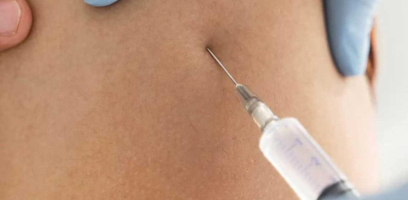 Stomach Photo Being Injected with Vaccine for Ebola Trial Patient