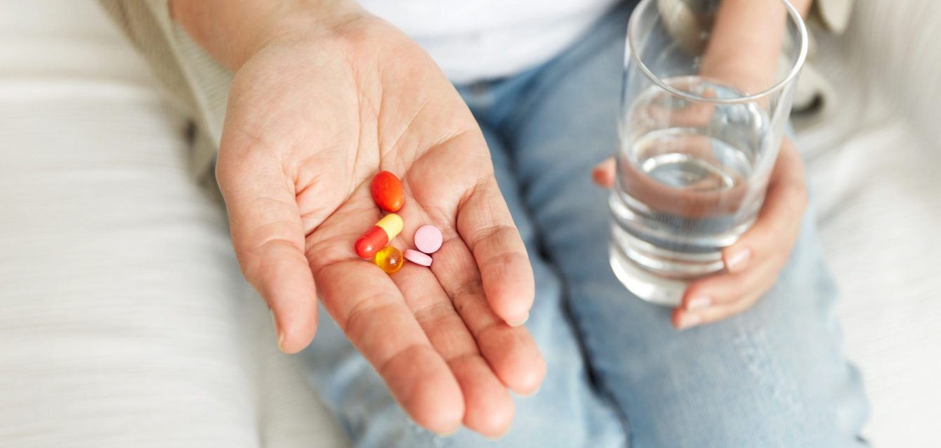 Pills, tablets, vitamins and drugs heap in mature hands, closeup view. Pills, tablets, vitamins and drugs heap in mature hands, closeup view.