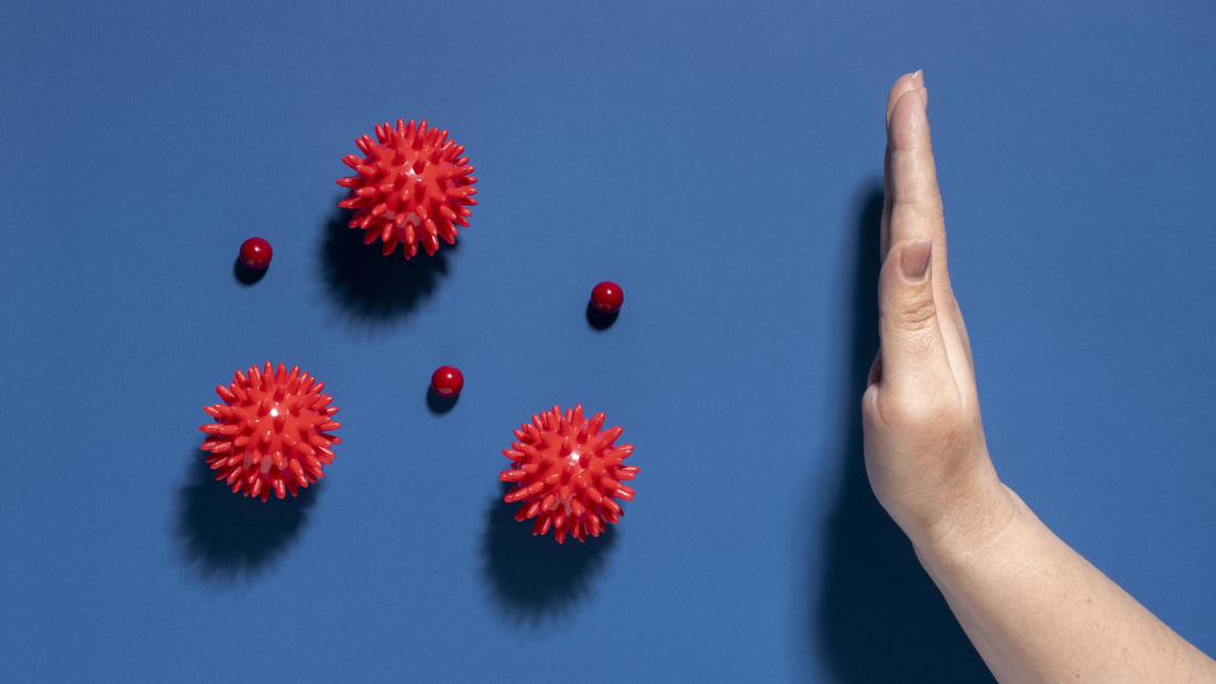 flat-lay-hand-stopping-viruses