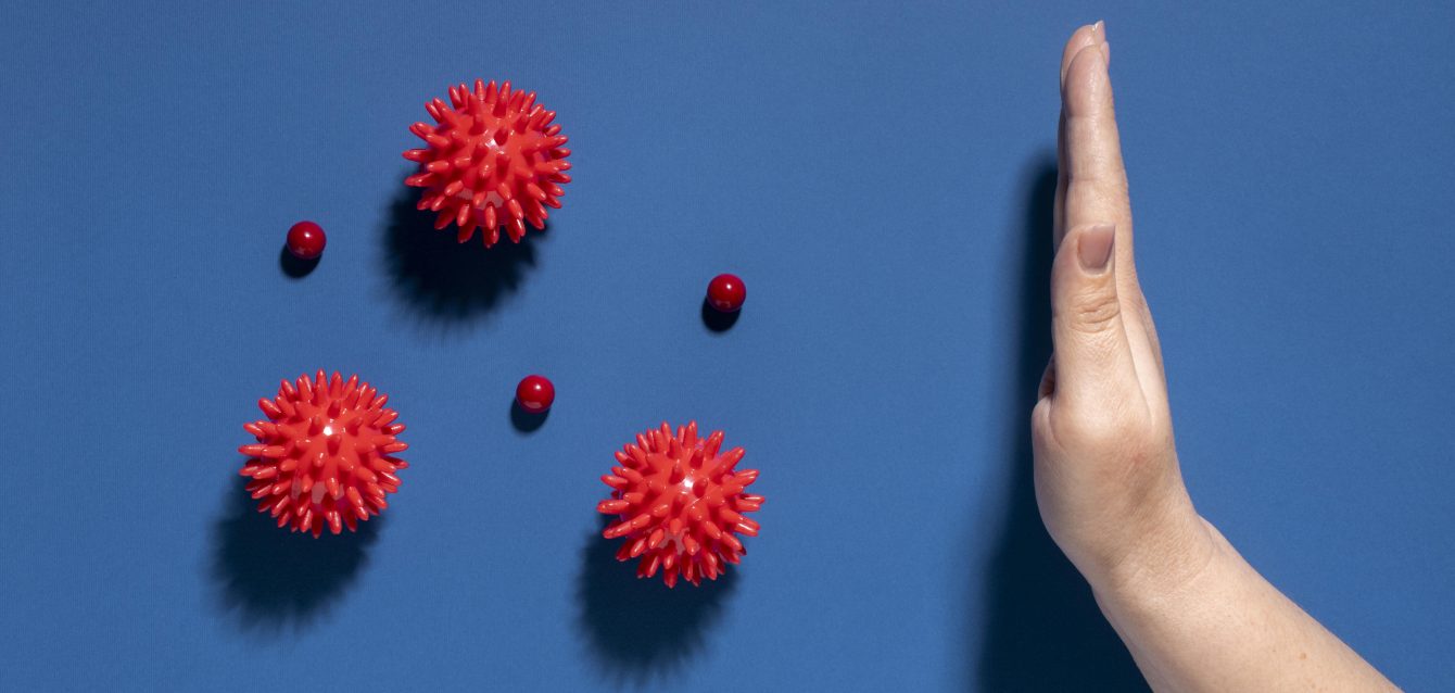 flat-lay-hand-stopping-viruses flat-lay-hand-stopping-viruses