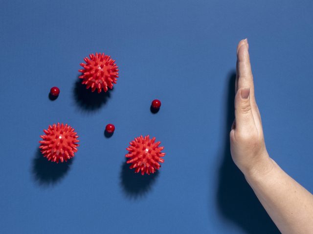 flat-lay-hand-stopping-viruses