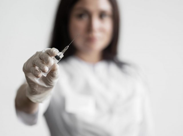 doctor-preparing-medical-vaccine doctor-preparing-medical-vaccine