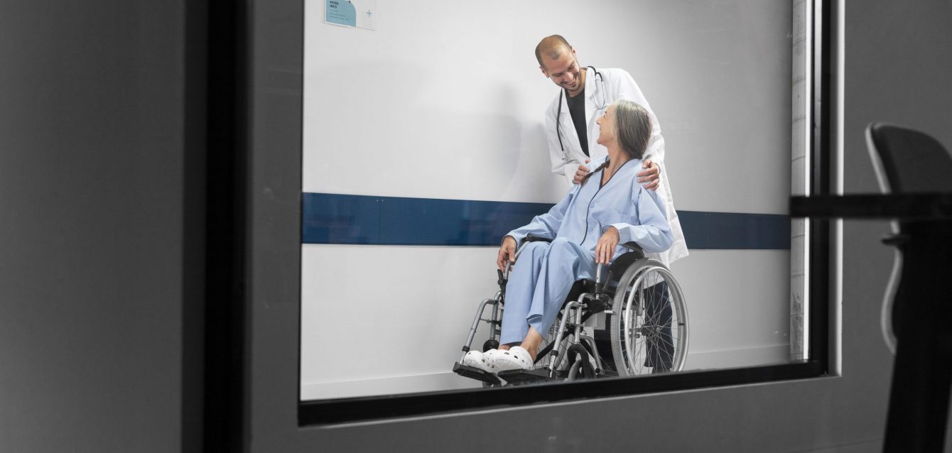 full-shot-doctor-patient-wheelchair