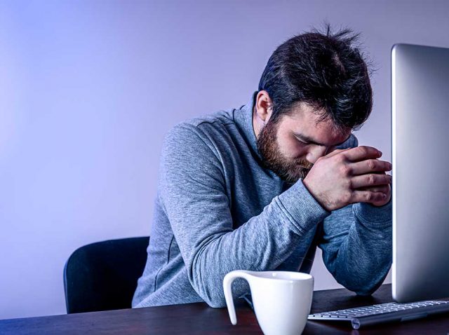 Anxiety Setsin After Coffee Photo of Man at Computer