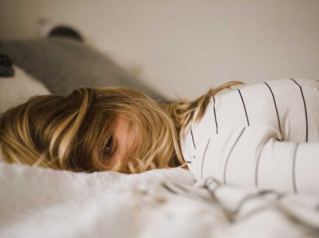 Insomnia and Depression Relationship Types and Causes Photo of Woman Lying Down