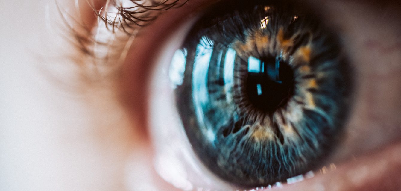Extreme closeup of an enlarged human eye with beautiful colors