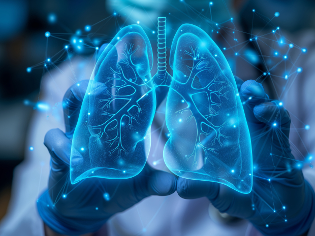 A doctor wearing a white coat and blue gloves holds a 3D model of the human lungs. The model is transparent and blue, showing the intricate internal structure. The model is illuminated with small, white lights, and is surrounded by a network of blue lines.