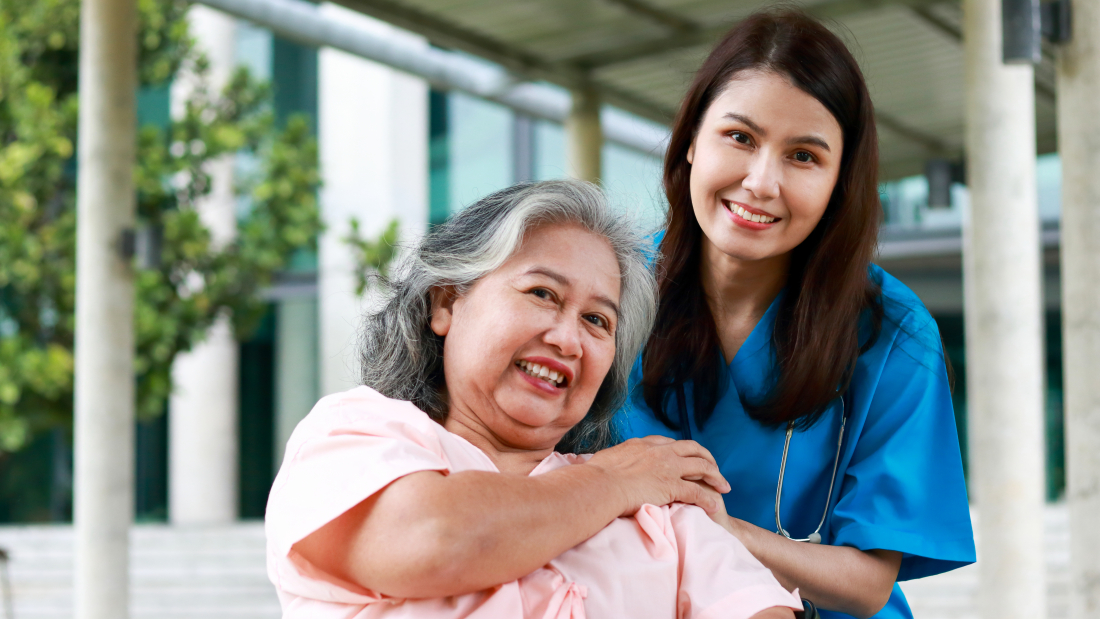 Asian female doctor treats an elderly patient sitting in a wheelchair. Concept of medical services in hospitals. surgical treatment of patients